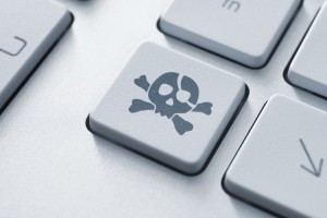 software-piracy-keyboard-skull-music-pirate-cyber-crime-750x500